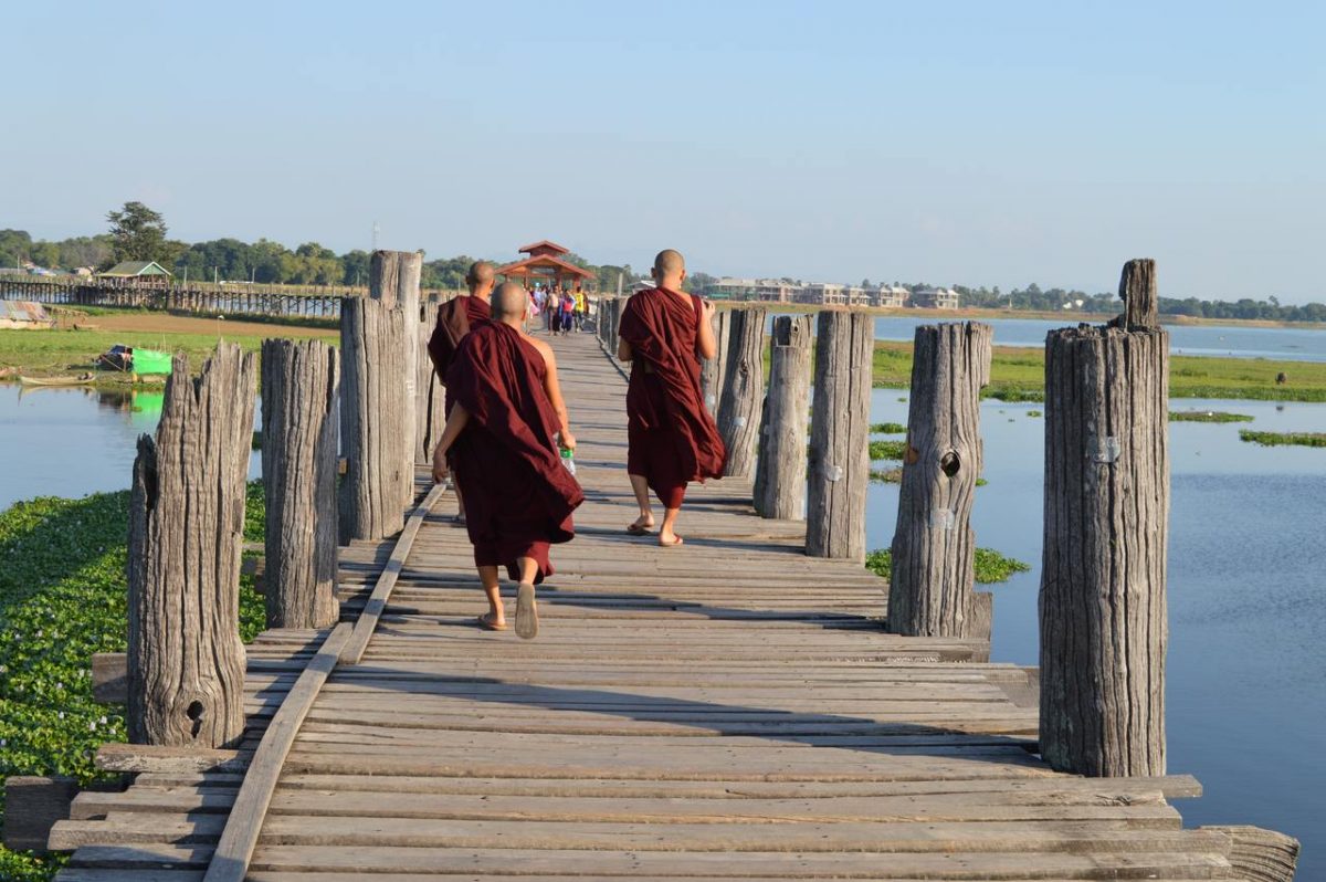 Monks promenading on U Bein Bridge near Mandalay